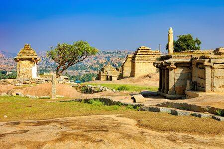 View from Hemakuta hill sunset point with ancient ruins, Hampi, Karnataka, India. Landscape with unique mountain formation with amazing stones, tropical nature and temple.の写真素材