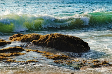 Coast of the sea with a wave rolling to shore, Nang Thong Beach, Khao Lak, Thailand.の写真素材