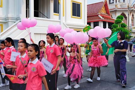 Bangkok, Thailand - January 8, 2016: Pupils of the Elementary School of Wat Chana Songkhram during festive procession through the streets of the city. A festive and beautifully dressed Thai childrenのeditorial素材
