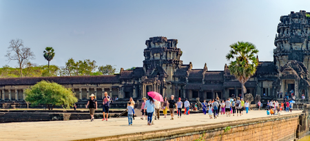 Siem Reap, Cambodia - February 1, 2016: Unidentified tourists visit to main entrance of Angkor Wat temple, Siem Reap, Cambodia. The largest religious monument in the world.のeditorial素材
