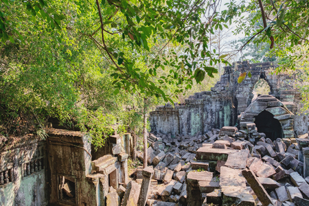 Prasat Beng Mealea in Angkor Complex, Siem Reap, Cambodia. It is largely unrestored, old trees and brush growing amidst towers and many of its stones lying in great heaps. Ancient Khmer architecture.の写真素材