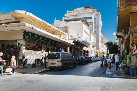 Athens, Greece - September 22, 2017: Evripidou Street, where Varvakeios Municipal Market is located, is full of small shops selling various commodities. Commercial centre of Athens.のeditorial素材