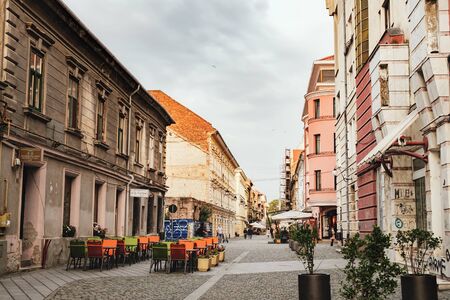 Timisoara, Romania - September 26, 2017: Street lined up with street cafes and restaurants in...