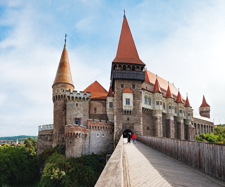 Wooden bridge across the moat to the main gate to the Corvin Castle, which also known as Castelul Corvinilor is a Gothic-Renaissance castle in Hunedoara, Romania.のeditorial素材
