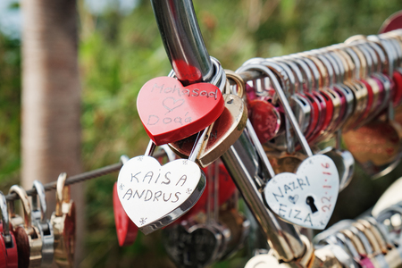 Langkawi, Malaysia - February 16, 2016: Love padlocks at Langkawi SkyCab, Cable Car. Locks of love is a custom in some cultures which symbolize their love will be locked forever.のeditorial素材