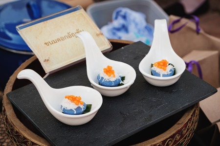 Kanom Dok Un Chan is the traditional Thai dessert for sale at fair near Ananta Samakhom Palace Throne Hall, Bangkok,Thailand. Translation from Thai to English: Butterfly Pea Rice Cakesの写真素材