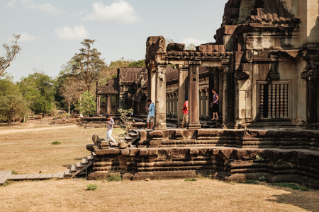 Siem Reap, Cambodia - February 1, 2016: Unidentified tourists visit to Angkor Wat temple and taking photos, Siem Reap, Cambodia.のeditorial素材