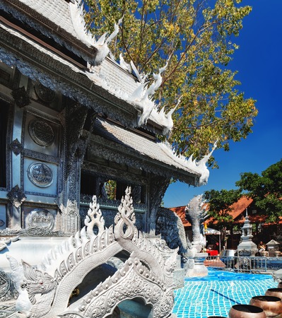 Wat Si Suphan has aluminium and silver decoration over delicate carving with stories of Buddhism, dharma puzzles, and the history of the temple and located in Chiang Mai, Thailand.のeditorial素材