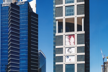 Doha, Qatar - March 3, 2018: Futuristic skyline Dolphin Energy Tower is located on Conference Centre...