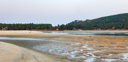 Tropical beach with fishing boats, Mobor Beach, South Goa, Indiaの写真素材
