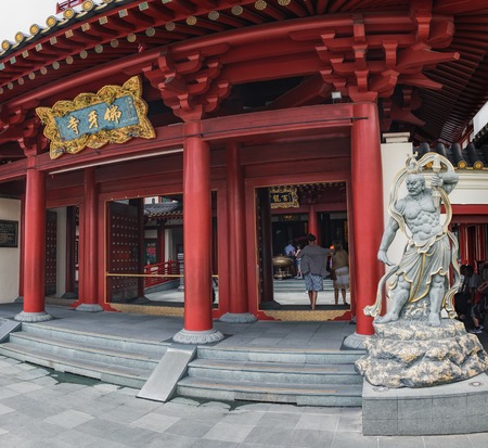 Singapore, Singapore - January 16, 2018: Statue of guard at the entrance to the Buddha Tooth Relic...