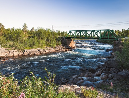 Picturesque panorama view of the railway bridge over the Rautas River near Rautas village in Kiruna municipality, Norrbotten, Sweden.の写真素材