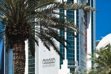 Doha, Qatar - March 3, 2018: Salam International Tower is the skyline at Al Corniche Street, the modern Doha city center in Qatar.のeditorial素材