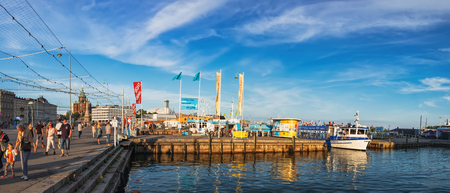 Helsinki, Finland - July 24, 2018: Tourists visit Old Town Pier in Helsinki and enjoy its architecture and waterfront with ships, Finlandのeditorial素材