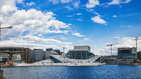 Summer panorama of the Oslo Opera House in Oslo, Norway. People visit and enjoy the view of modern Norwegian architectureのeditorial素材