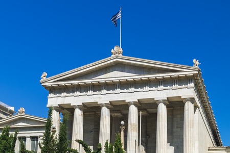 Classical marble building of National Library of Greece with flag in Athensのeditorial素材