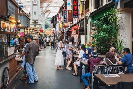Singapore, Singapore - January 17, 2018: Tourists visit the Chinatown Food street and enjoy dishes of different cuisines, Singaporeのeditorial素材