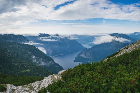 Panoramic summer view of Lake Hallstatt and surrounding mountains taken from Hallstatt skywalk, Salzkammergut, Austriaの写真素材