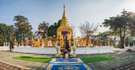 Mae Sai, Thailand - February 10, 2018: Tourists visit Wat Phra That Doi Wao Temple and enjoy the views of golden pagoda on the top of the hillのeditorial素材