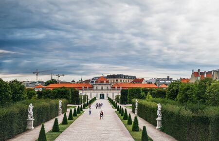 Vienna, Austria - August 19, 2019: Tourists visit beautiful Belvedere garden and Lower Belvedere Palace, Vienna, Austria.のeditorial素材