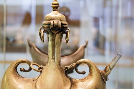 Kuala Lumpur, Malaysia - February 11, 2016: The top of the ancient brass pilgrim flask at the Islamic Arts Museum in Kuala Lumpur, Malaysia. Selective focusのeditorial素材