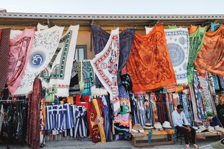 Athens, Greece - September 22, 2017: Multicolored textile of scarf and pareo with authentic pattern for sale on the Monastiraki flea market in Athens, Greeceのeditorial素材