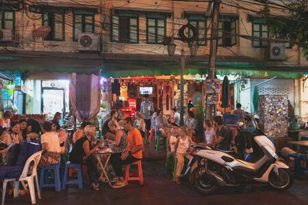 Bangkok, Thailand - March 2, 2018: Thai street cafe with people on Khaosan road at night, popular food street and famous district for back packer and budget tourist.のeditorial素材