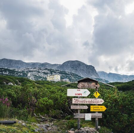 Obertraun, Austria - August 22, 2019: Road signs about sights in Dachstein Mountains, Salzkammergut region, Upper Austria, Austria.のeditorial素材