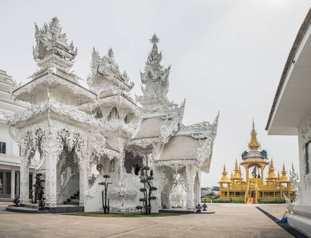 Beautiful golden and white ornate buildings of White Temple - Wat Rong Khun in Chiang Rai, Thailandの写真素材