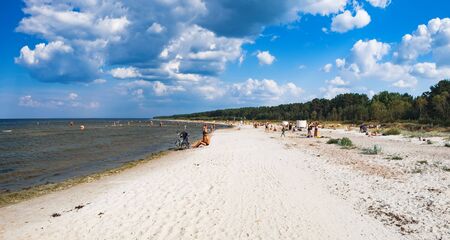 Jaunkemeri, Latvia - July 21, 2018: People swim and have rest on the beach of Jaunkemeri, located near Kemeri National Park and Jurmala city, Latviaのeditorial素材