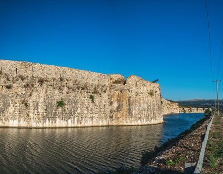Walls and moat of Santa Maura Castle under blue sky, it's large and beautiful fort located at the entrance to the Lefkada island, Greeceのeditorial素材