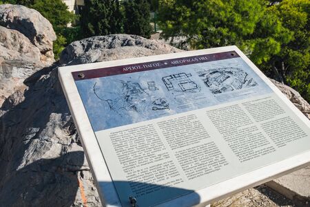 Athens, Greece - September 22, 2017: Signpost for tourists about the Areopagus hill in Plaka in front of the Acropolis of Athensのeditorial素材