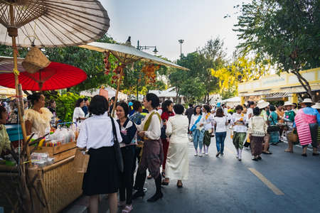 Bangkok, Thailand - March 2, 2018: Thai people in national traditional clothes walking, buying food and enjoying outdoor fair street market near Ananta Samakhom Palace Throne Hall in Bangkok,Thailand.のeditorial素材