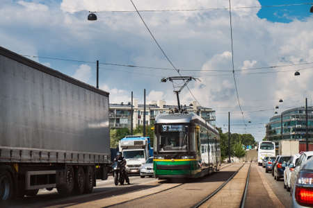 Helsinki, Finland - July 24, 2018: Finnish smart public green city tram, transport and street view...