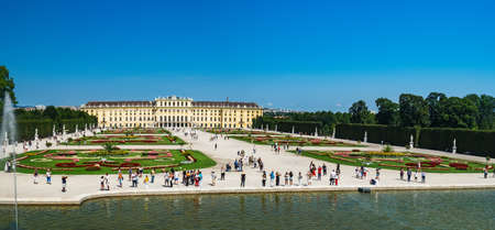 Vienna, Austria - August 20, 2019: Tourists visit beautiful Schonbrunn Palace. It's a former imperial Rococo summer residence in Vienna, Austria.のeditorial素材