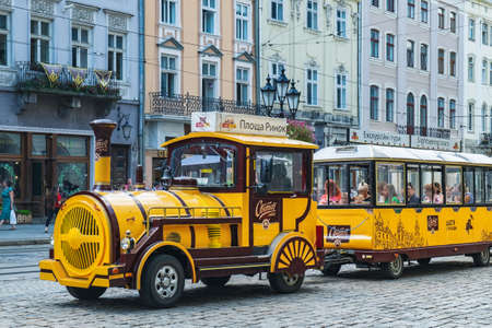 Lviv, Ukraine - July 4, 2018: Tourist train in central square, Old Town of Lviv, Ukraine....