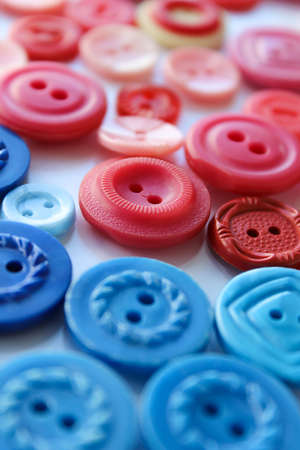 Close up red and blue buttonsの写真素材