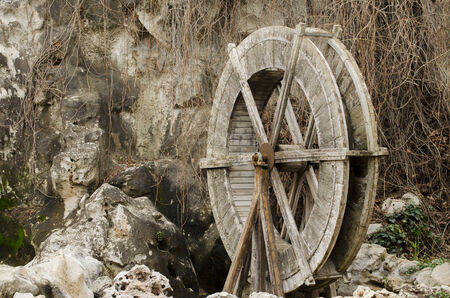 Wooden wheel of an old water millの写真素材