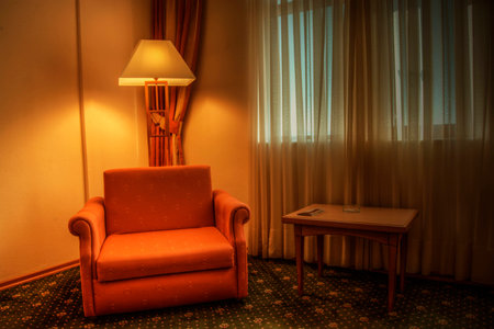Beautiful room with red armchair and lampの写真素材