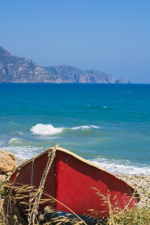 Abandoned Red Boat on the beachの写真素材