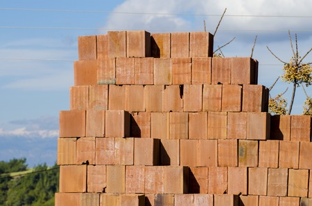 Stack of red bricks, bricks used for building construction