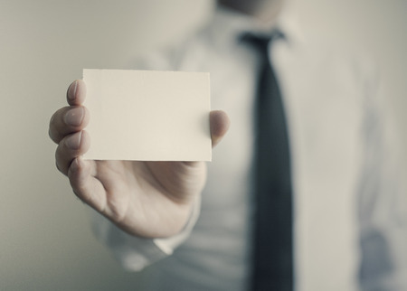 Man\'s hand showing business cardの写真素材