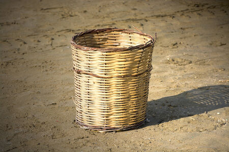 Straw baskets on the sandの写真素材