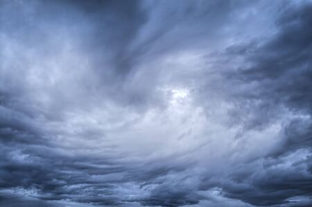 dark blue  storm clouds before rainの写真素材