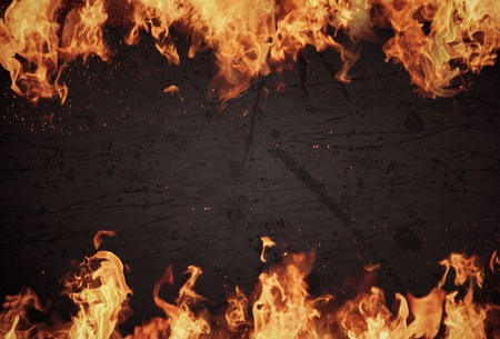 Blazing flames over dark background
