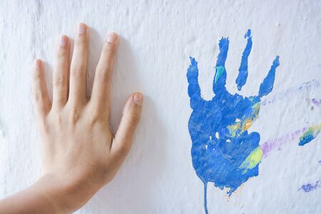 Painting wall with handsの写真素材
