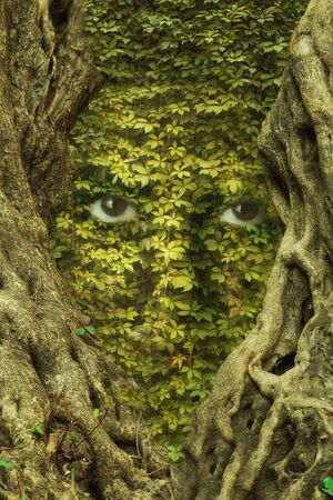 Woman face with leaf texture and green eyes. Ecology concept.