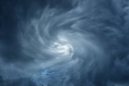 White Hole in the Whirlwind of dark storm cloudsの写真素材