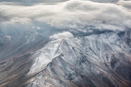 A snow covered Mountains with Clouds
