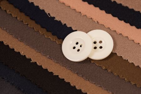 Close-up of a button on fabric samplesの写真素材